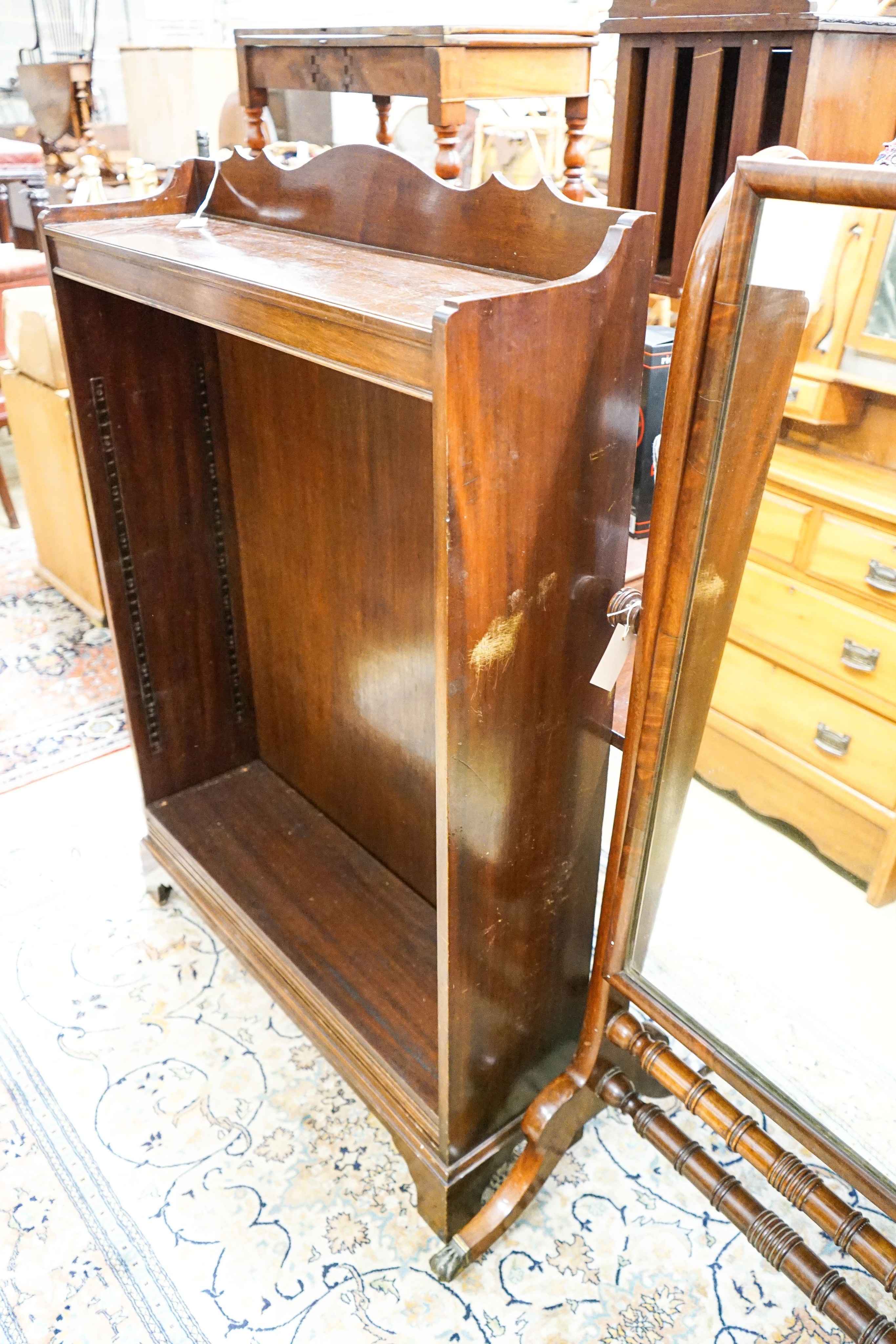 A 1920's mahogany open bookcase, length 92cm, depth 25cm, height 130cm